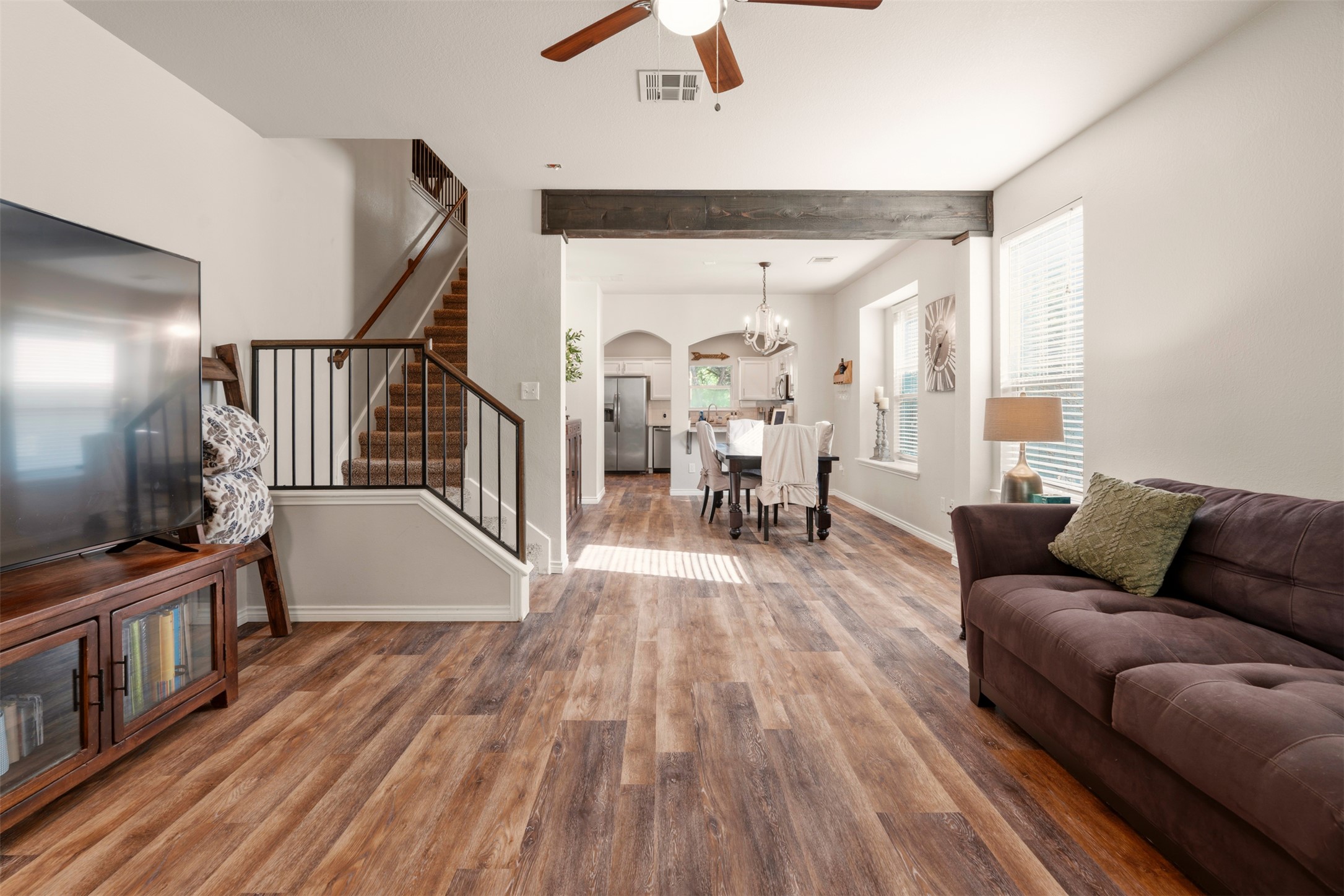 913 Bogart Road Cedar Park, TX 78613 - Photo 9 of 27 Living area featuring a ceiling fan, light wood-type flooring, and a chandelier