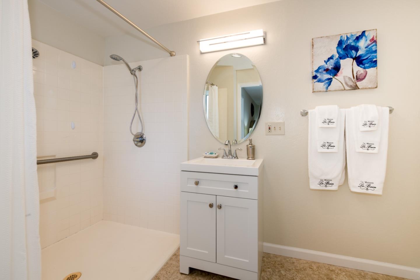 250 Vincent Drive Mountain View, CA 94041 - Photo 11 of 23 a bathroom with a bathtub a sink and a mirror