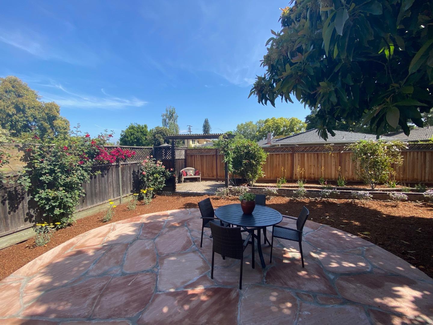250 Vincent Drive Mountain View, CA 94041 - Photo 14 of 23 a view of a patio with table and chairs and potted plants
