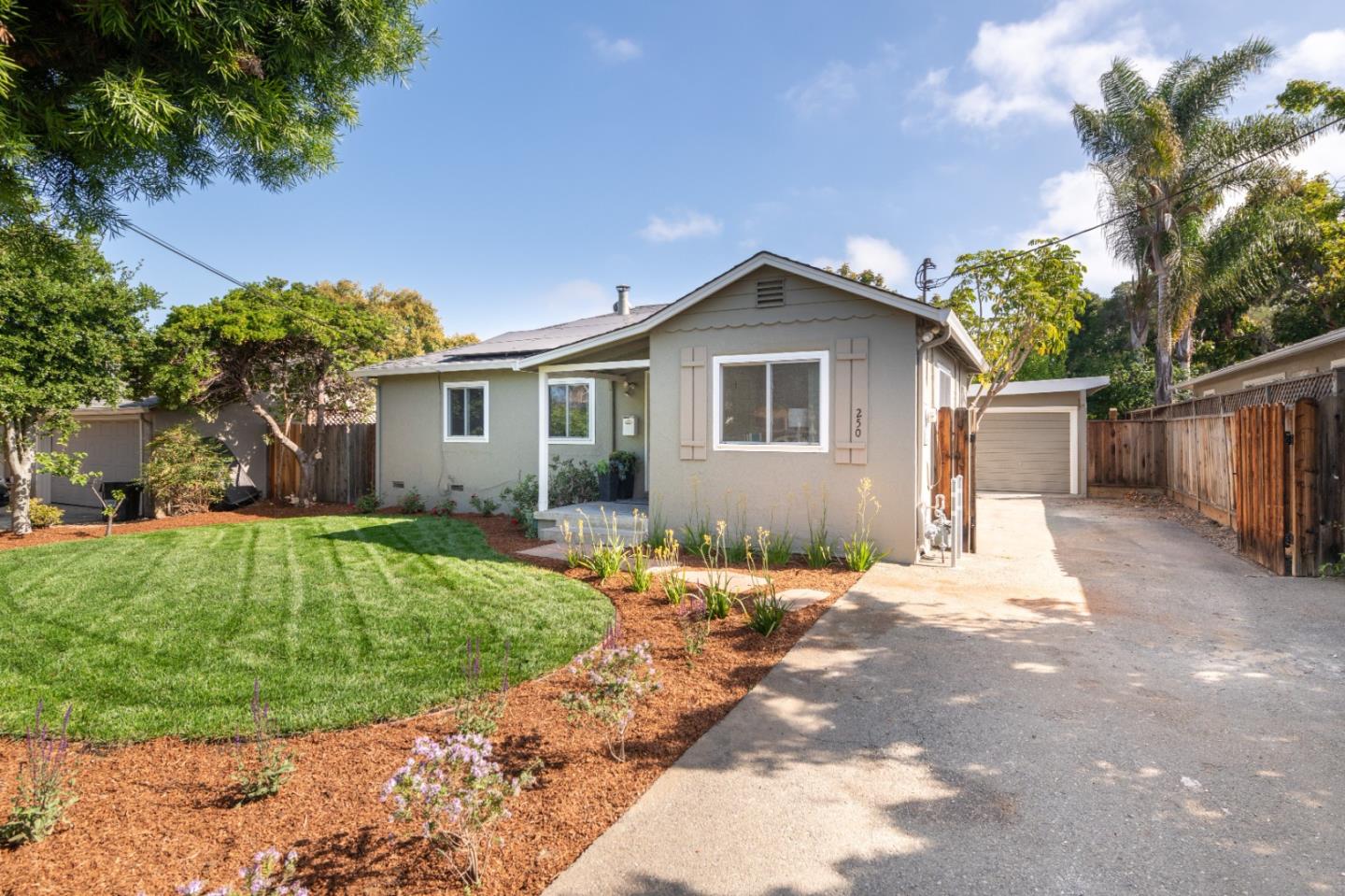 250 Vincent Drive Mountain View, CA 94041 - Photo 20 of 23 a front view of a house with a yard and trees
