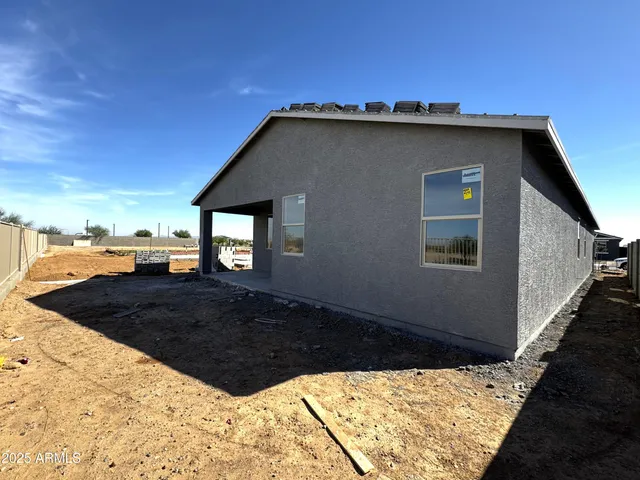 a view of a backyard of the house