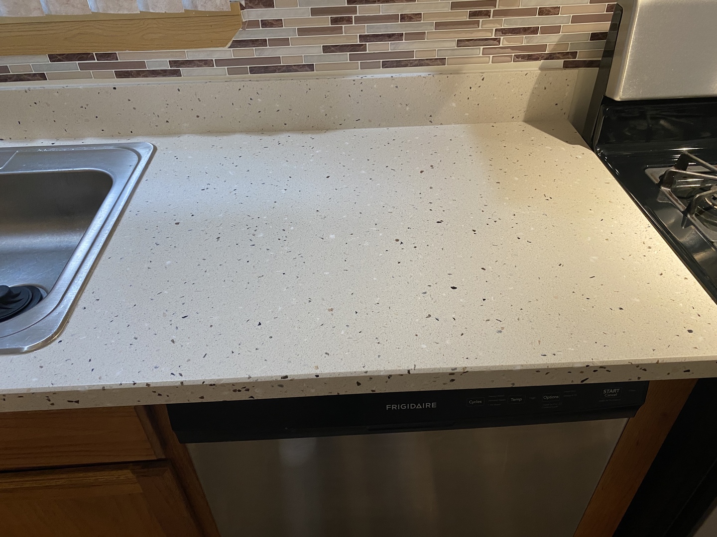 922 North Springfield Avenue Chicago, IL 60651 - Photo 17 of 47 a view of a kitchen with an empty space and a stove