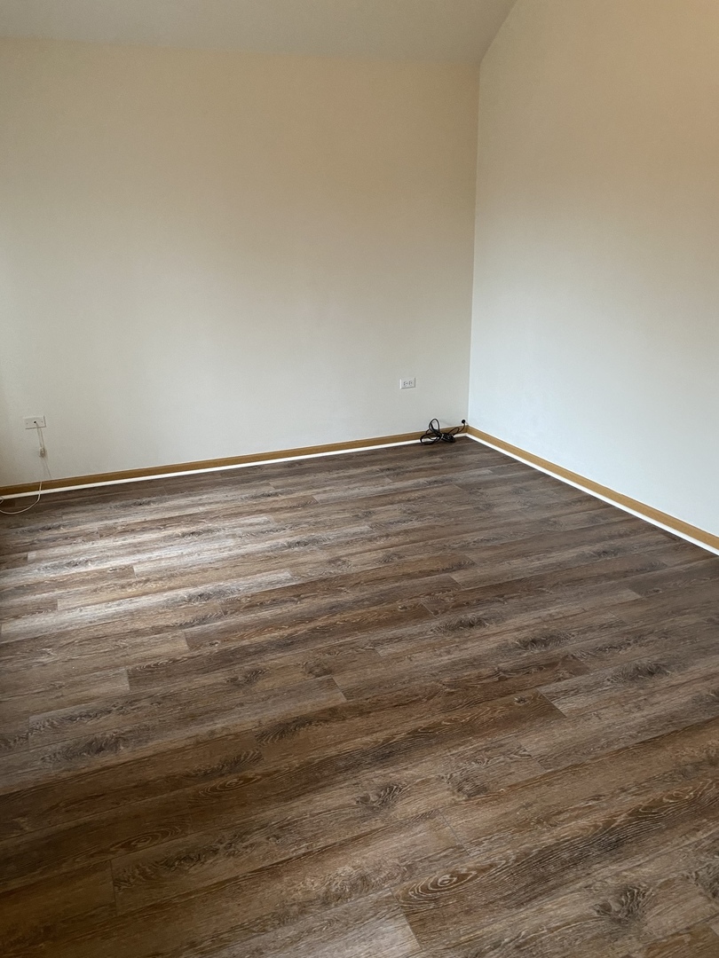 922 North Springfield Avenue Chicago, IL 60651 - Photo 20 of 47 a view of empty room with wooden floor