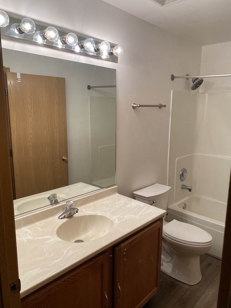 922 North Springfield Avenue Chicago, IL 60651 - Photo 26 of 47 a bathroom with a sink a toilet and shower