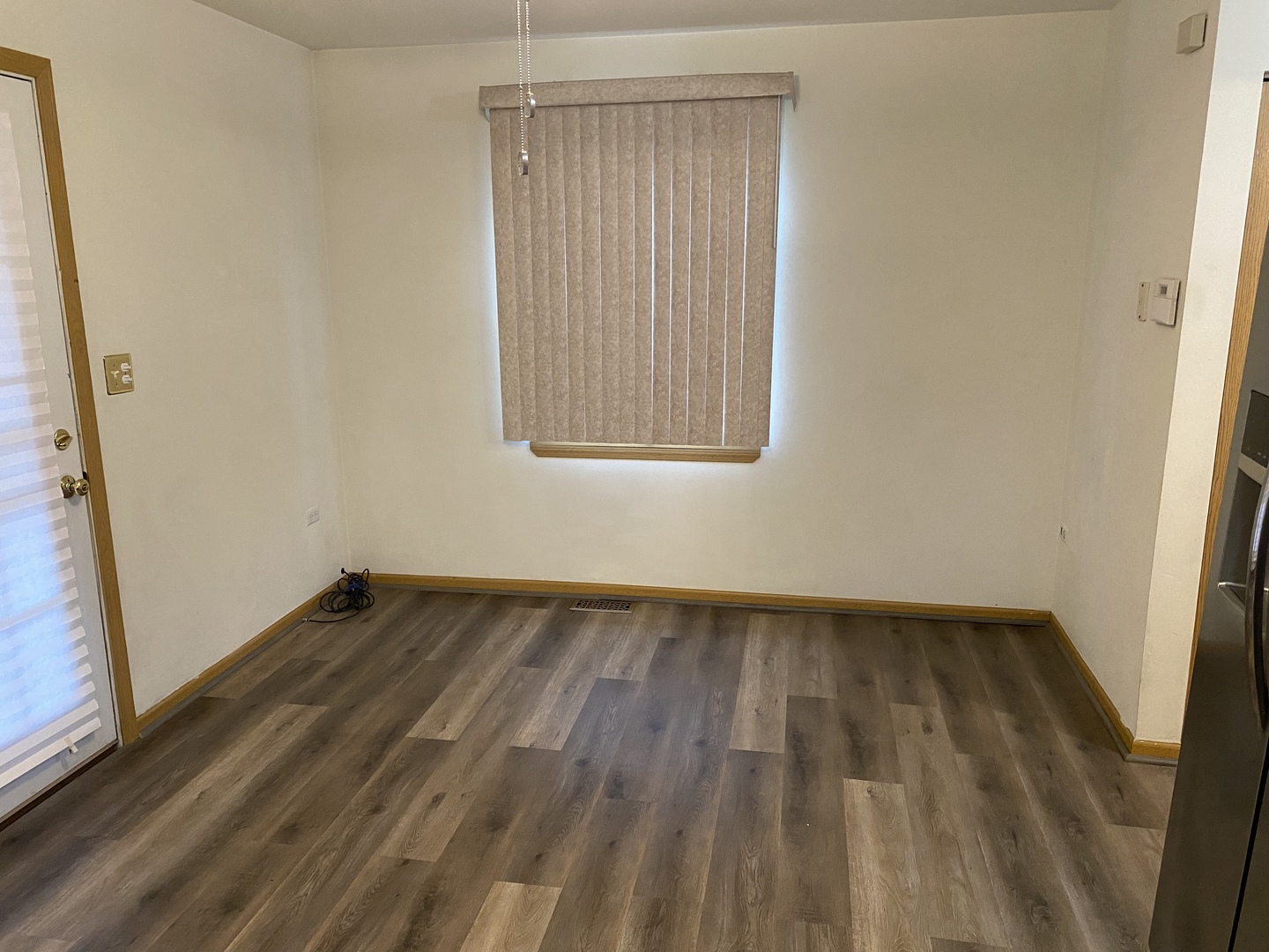 922 North Springfield Avenue Chicago, IL 60651 - Photo 35 of 47 an empty room with wooden floor and windows