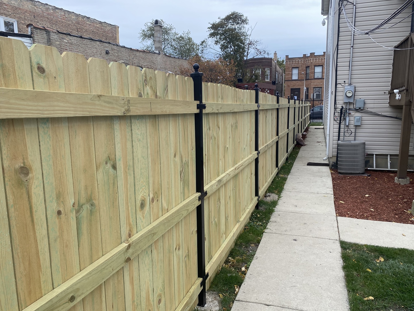 922 North Springfield Avenue Chicago, IL 60651 - Photo 37 of 47 a view of a street with wooden fence