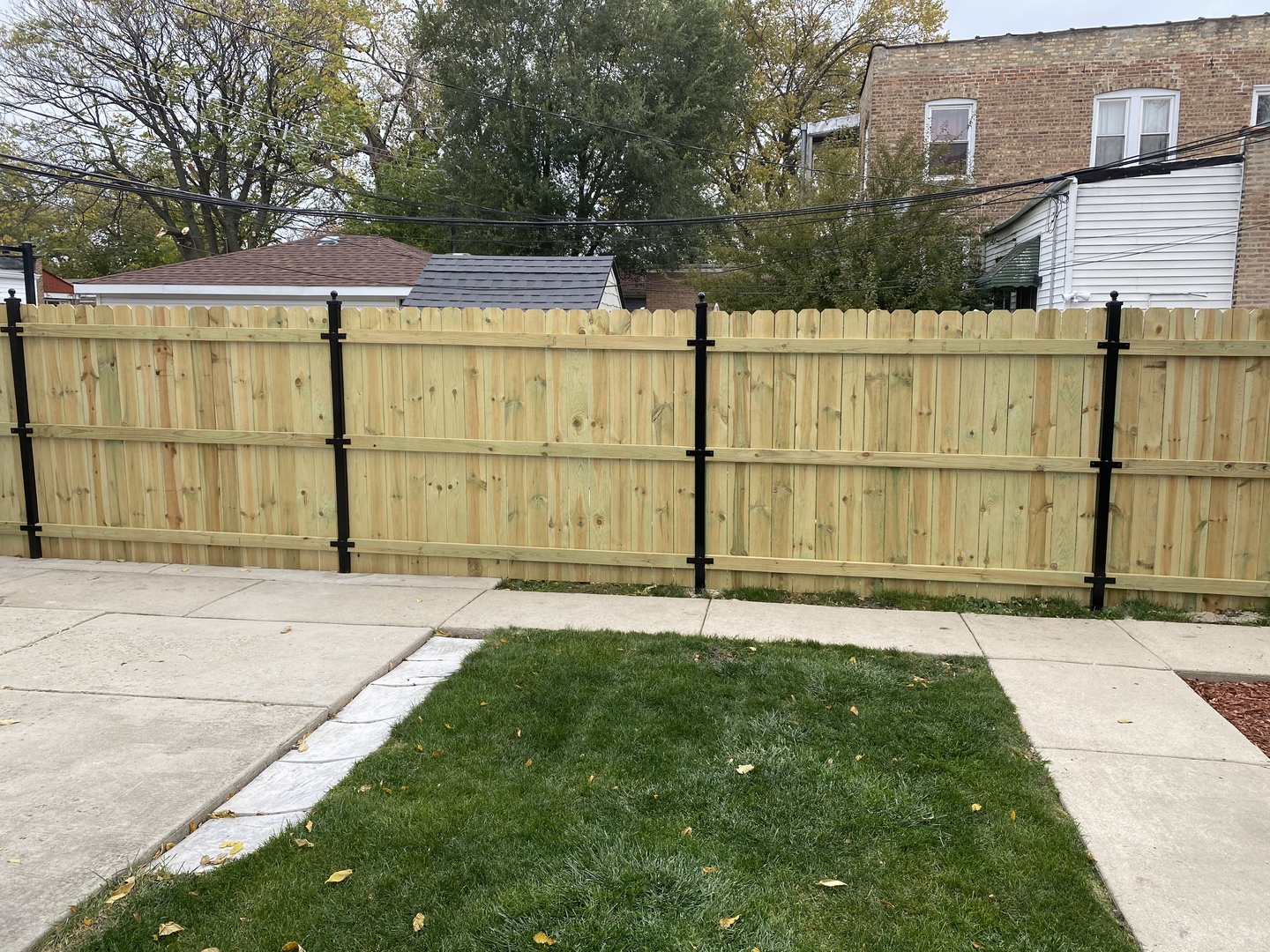922 North Springfield Avenue Chicago, IL 60651 - Photo 39 of 47 a front view of a house with a yard