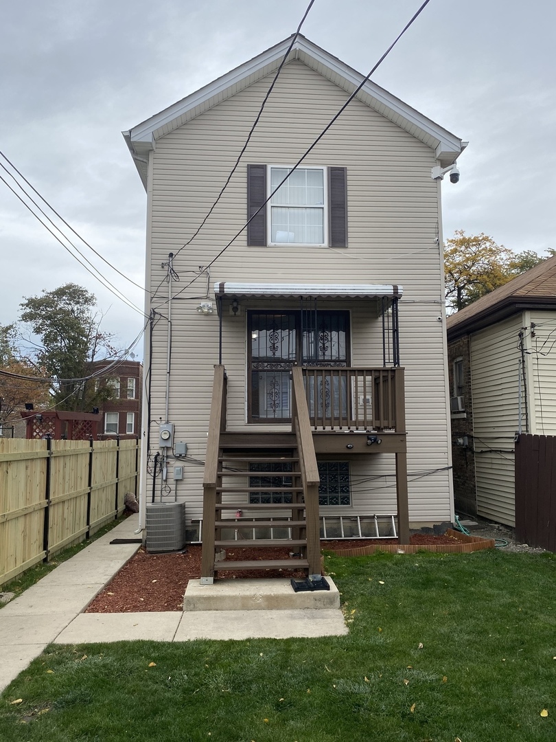 922 North Springfield Avenue Chicago, IL 60651 - Photo 40 of 47 a front view of a house with garden