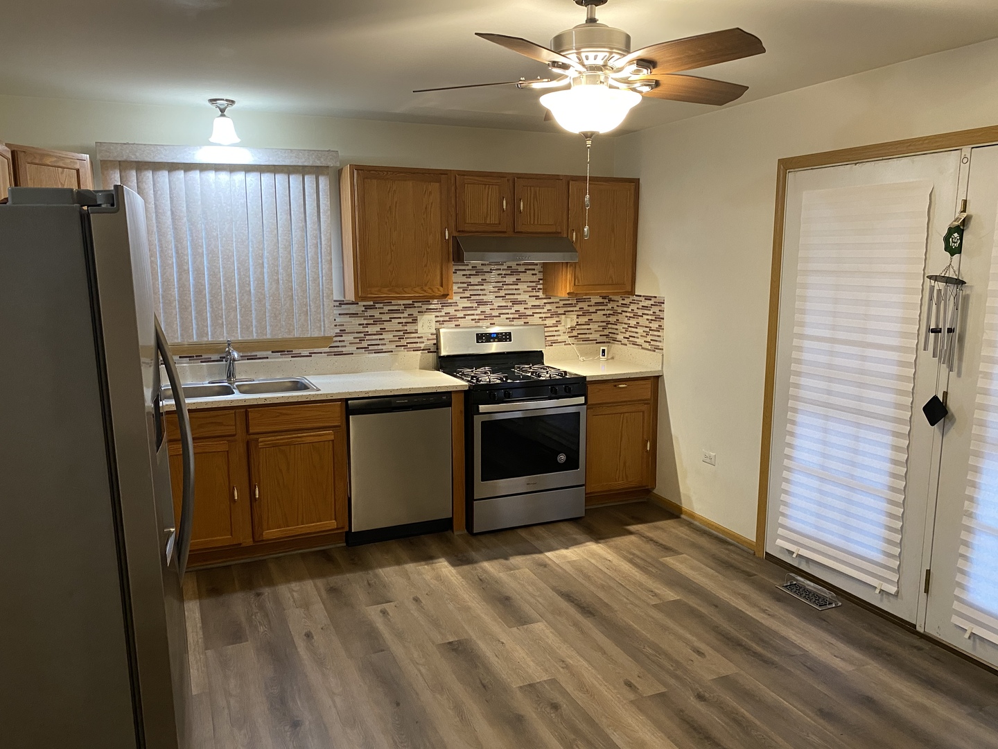 922 North Springfield Avenue Chicago, IL 60651 - Photo 7 of 47 a kitchen with stainless steel appliances granite countertop a stove and a refrigerator