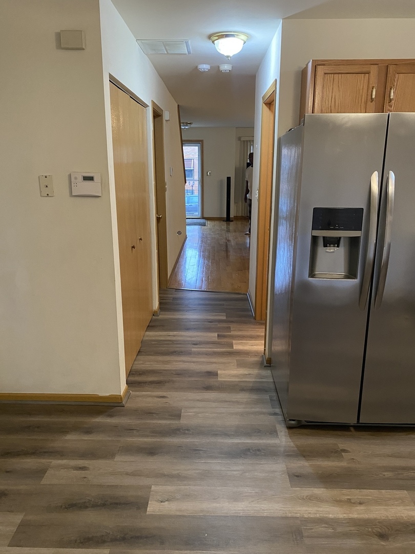 922 North Springfield Avenue Chicago, IL 60651 - Photo 8 of 47 a view of a hallway with wooden floor