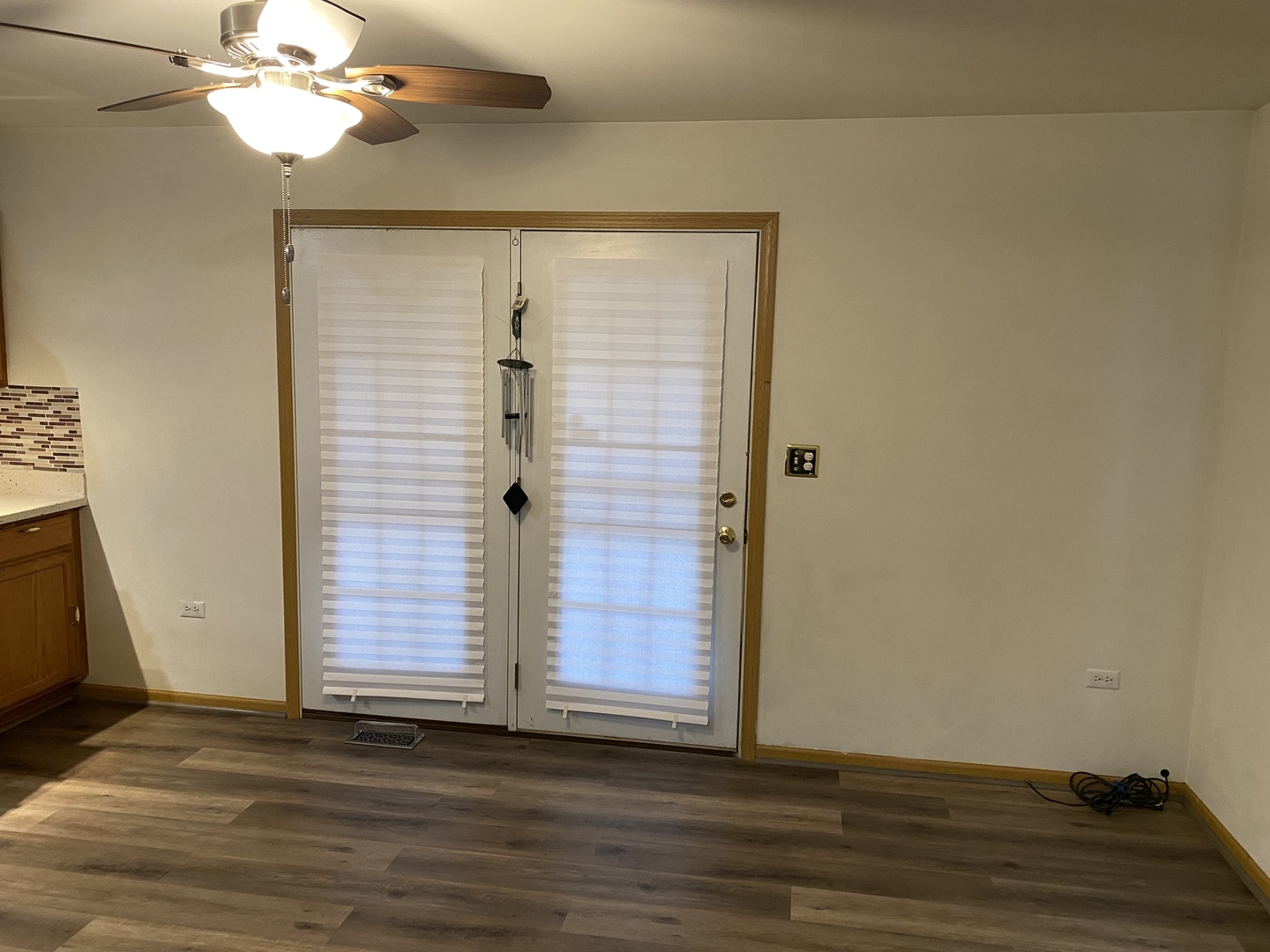 922 North Springfield Avenue Chicago, IL 60651 - Photo 9 of 47 a view of a livingroom with wooden floor and chandelier fan