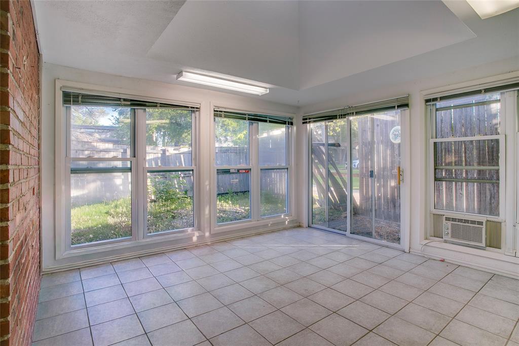 1439 Jr Drive Dallas, TX 75208 - Photo 15 of 39 a view of empty room with wooden floor and fan