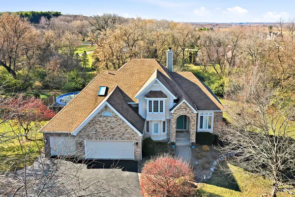 a aerial view of a house with a yard