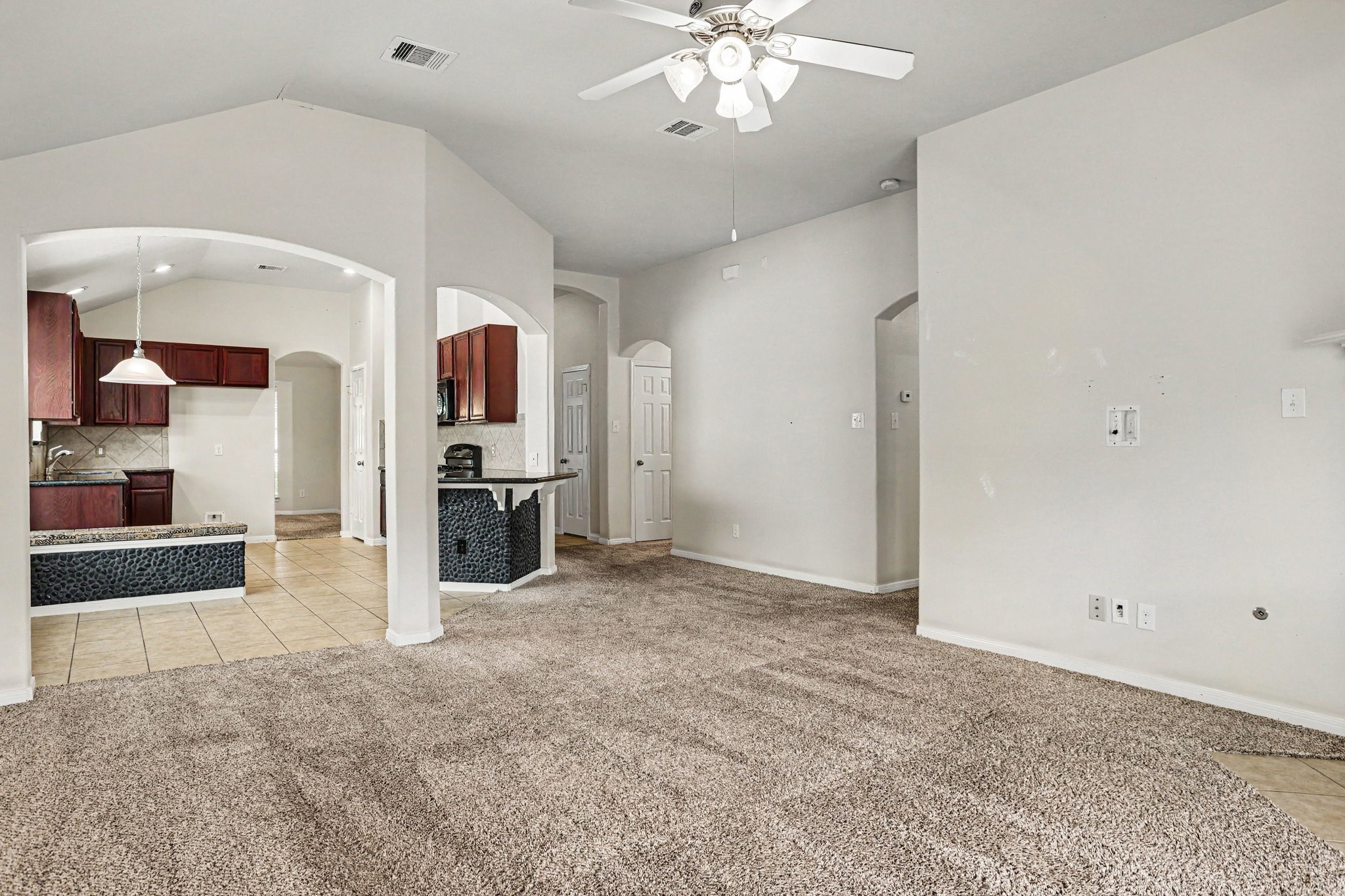 25222 Ginger Ranch Drive Katy, TX 77494 - Photo 12 of 33 Living room seamlessly connects to the kitchen to create a warm and inviting space.