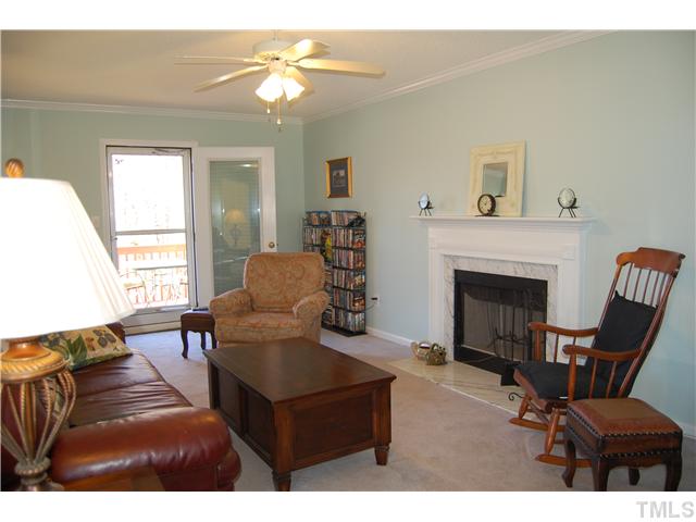 8520 Ridgebury Road Raleigh, NC 27603 - Photo 5 of 22 a living room with furniture and a fireplace