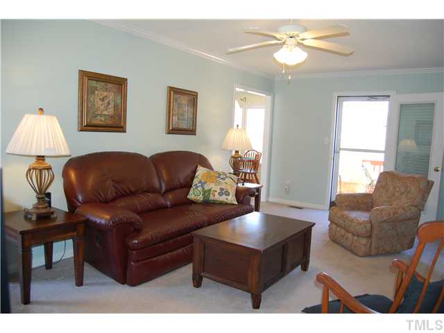 8520 Ridgebury Road Raleigh, NC 27603 - Photo 6 of 22 a living room with furniture and a window