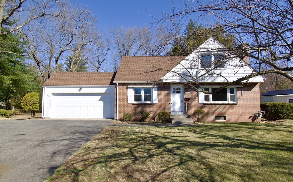 812 Maple Road Longmeadow, MA 01106 - Photo 1 of 22 a front view of a house with a yard