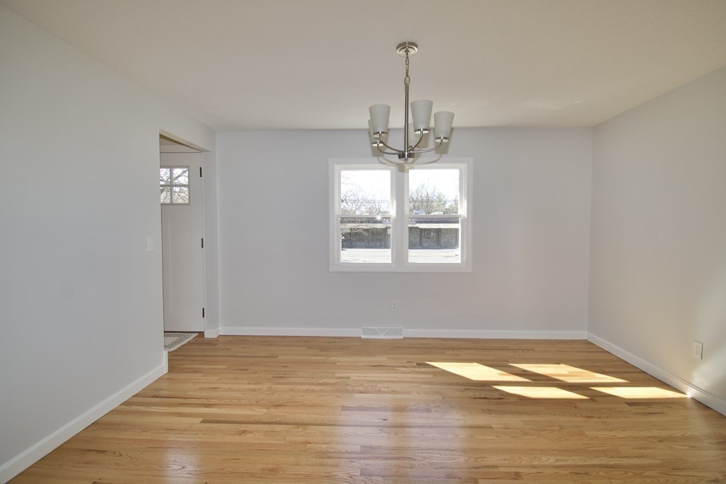 812 Maple Road Longmeadow, MA 01106 - Photo 6 of 22 a view of empty room with wooden floor and window