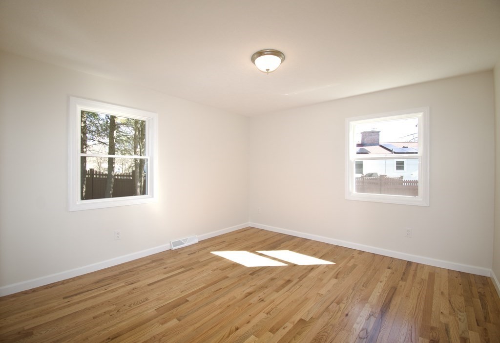 812 Maple Road Longmeadow, MA 01106 - Photo 10 of 22 a view of empty room with wooden floor and fan