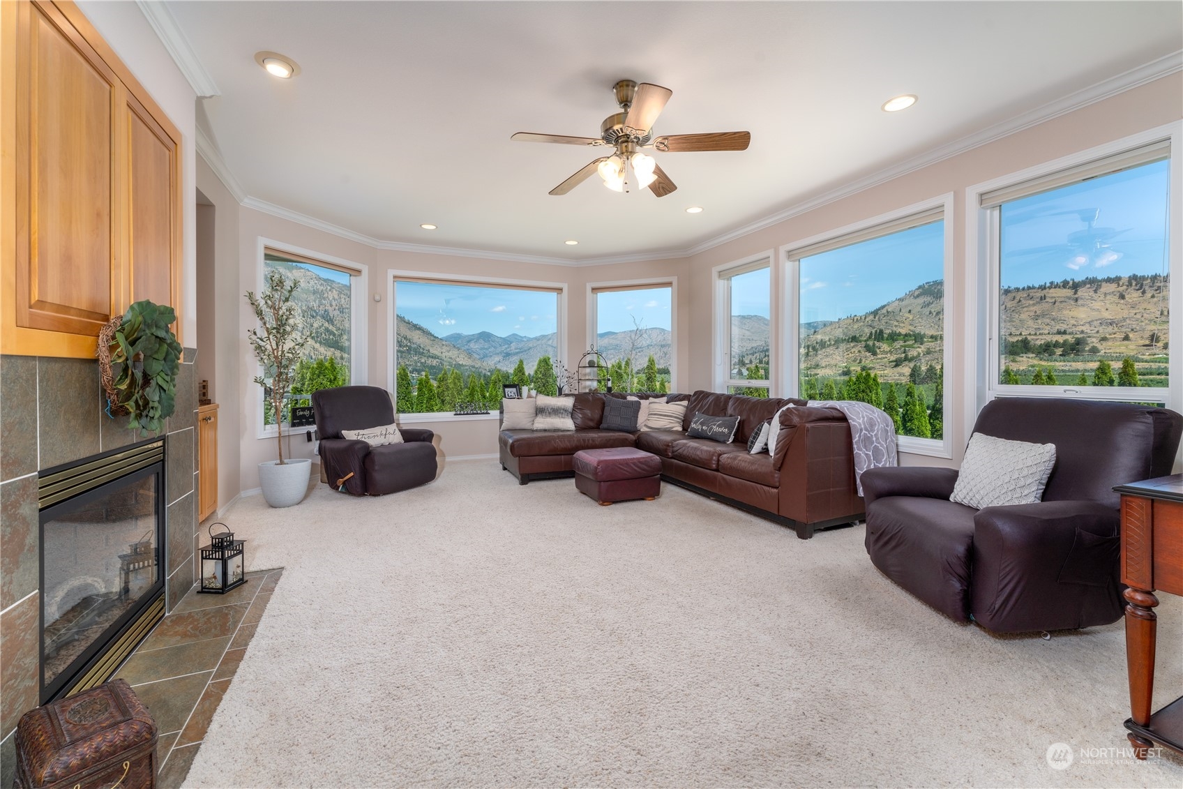 900 Loop Avenue Manson, WA 98831 - Photo 13 of 40 a living room with furniture large windows and a flat screen tv