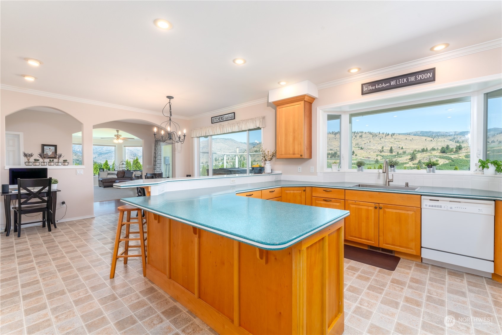 900 Loop Avenue Manson, WA 98831 - Photo 19 of 40 a kitchen with stainless steel appliances granite countertop a sink and a wooden cabinets