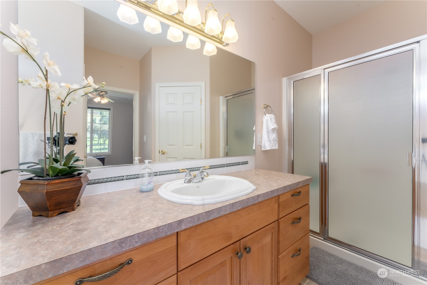 900 Loop Avenue Manson, WA 98831 - Photo 24 of 40 a bathroom with a sink a light fixture and a mirror