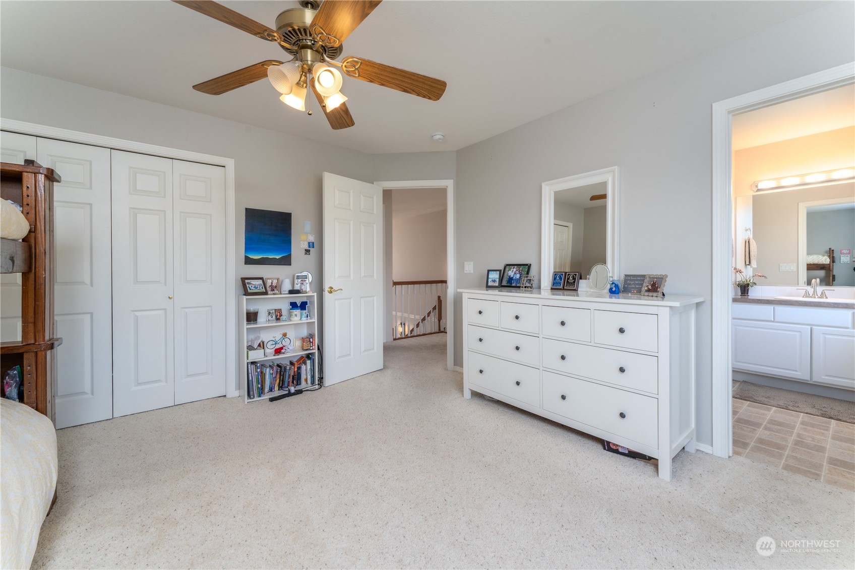 900 Loop Avenue Manson, WA 98831 - Photo 32 of 40 a view of a bedroom with cabinet cabinet and a chandelier fan