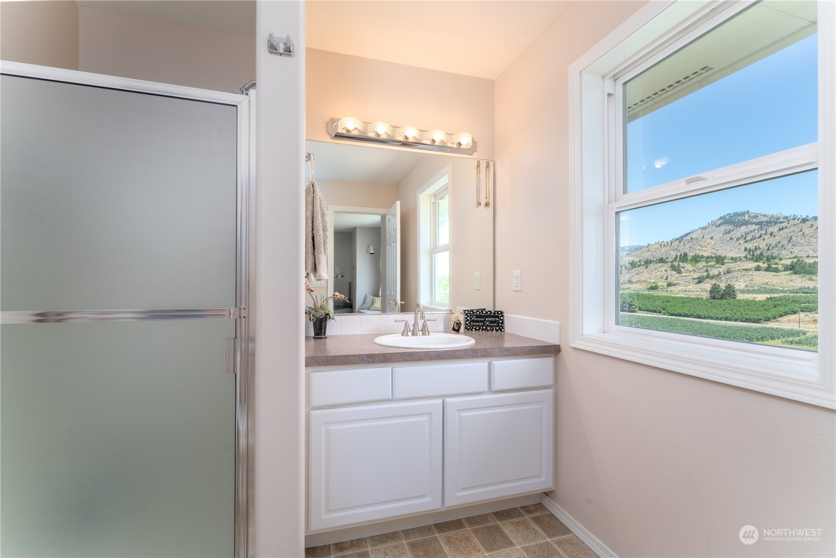 900 Loop Avenue Manson, WA 98831 - Photo 33 of 40 a bathroom with a sink and a mirror
