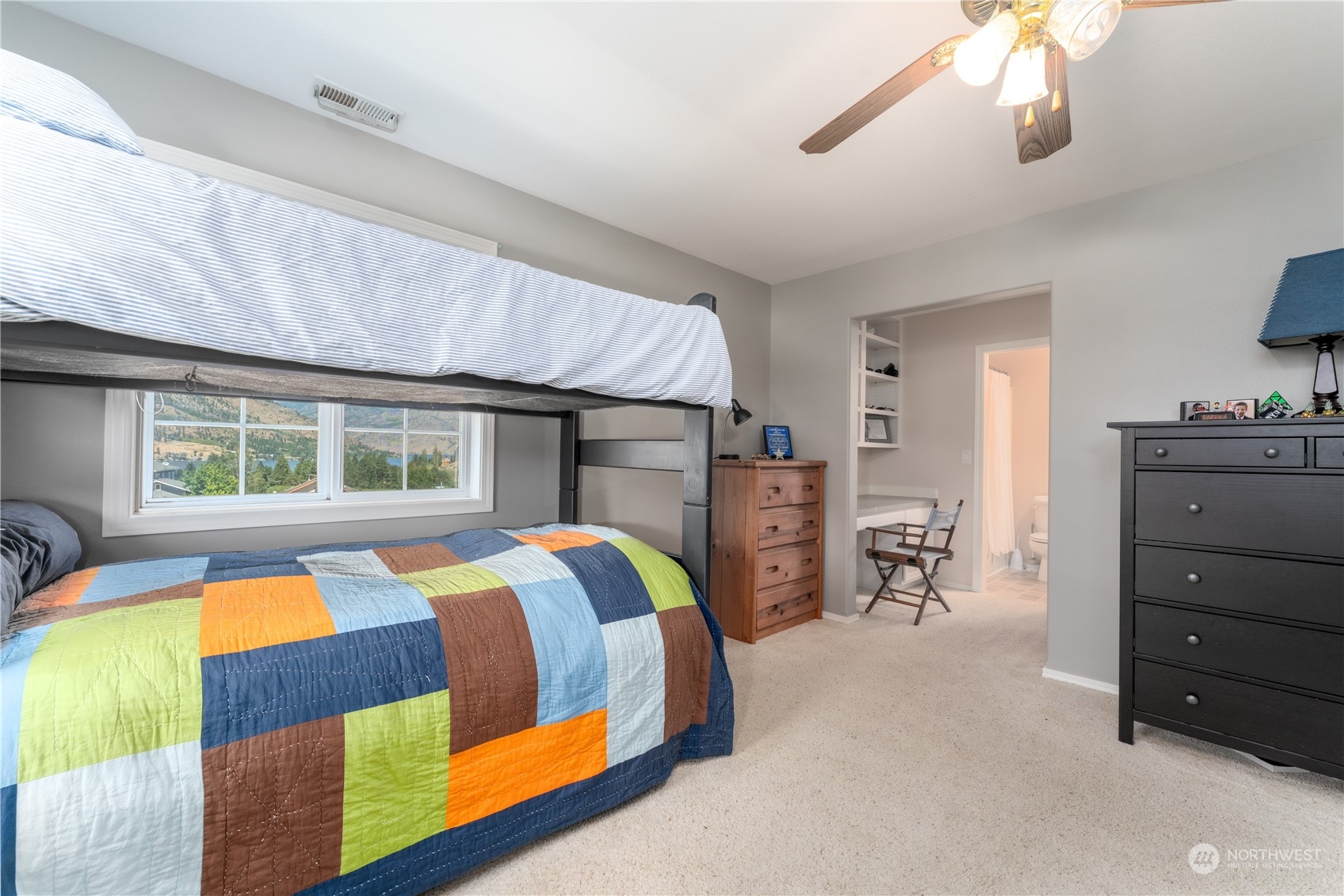 900 Loop Avenue Manson, WA 98831 - Photo 34 of 40 a bedroom with a bed and a dresser