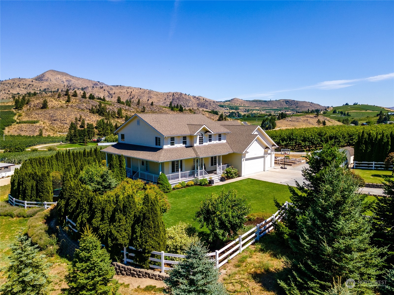 900 Loop Avenue Manson, WA 98831 - Photo 5 of 40 an aerial view of a house with a garden