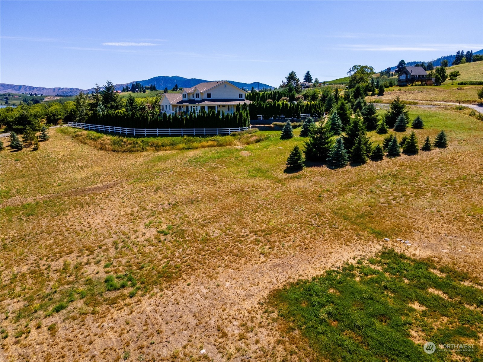 900 Loop Avenue Manson, WA 98831 - Photo 7 of 40 a view of a lake with houses