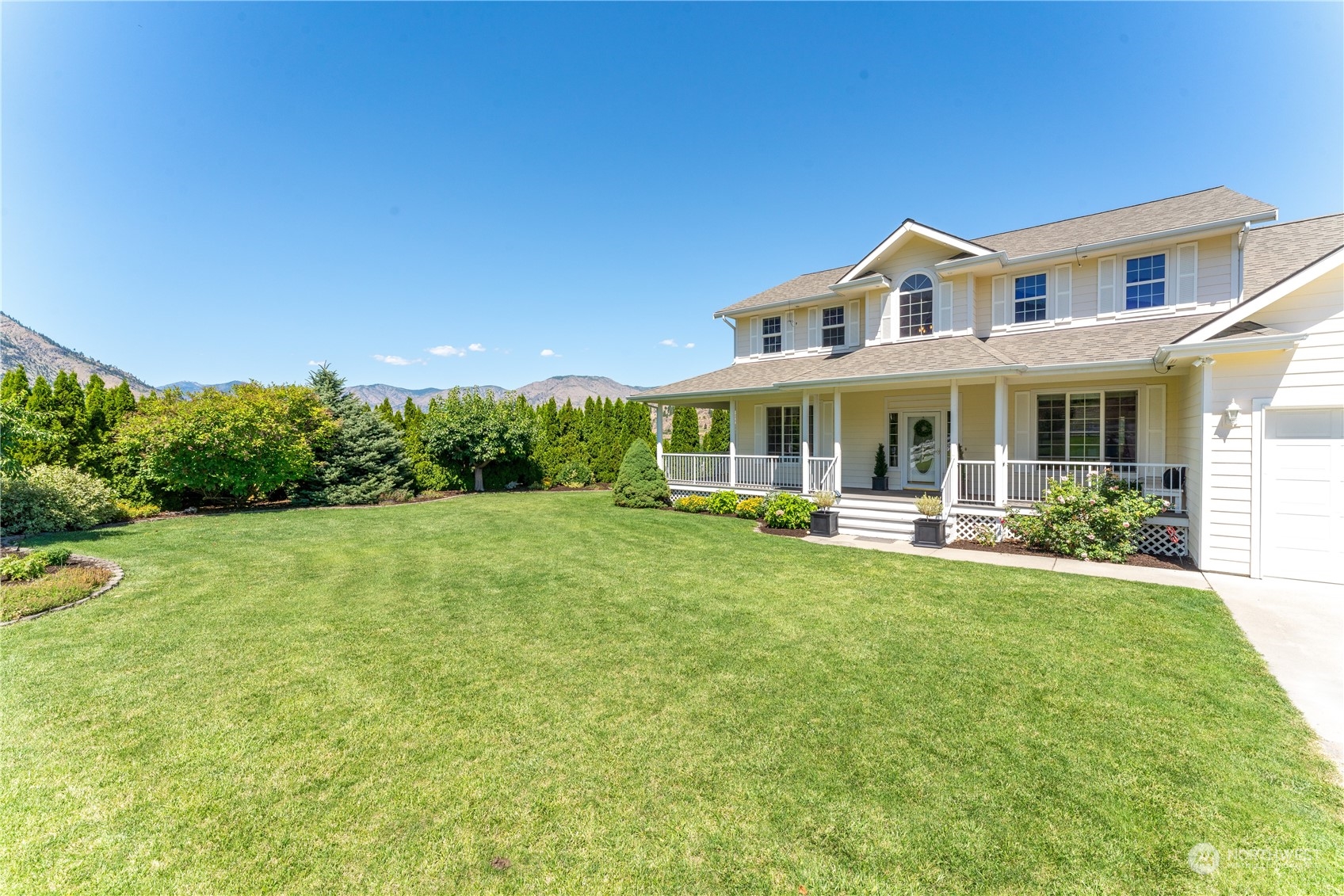 900 Loop Avenue Manson, WA 98831 - Photo 9 of 40 a front view of a house with swimming pool having outdoor seating