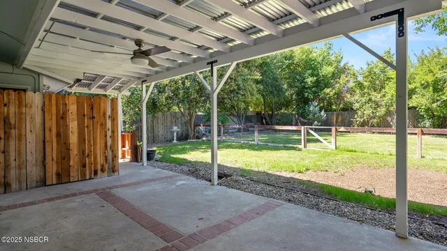 a view of a backyard with swimming pool