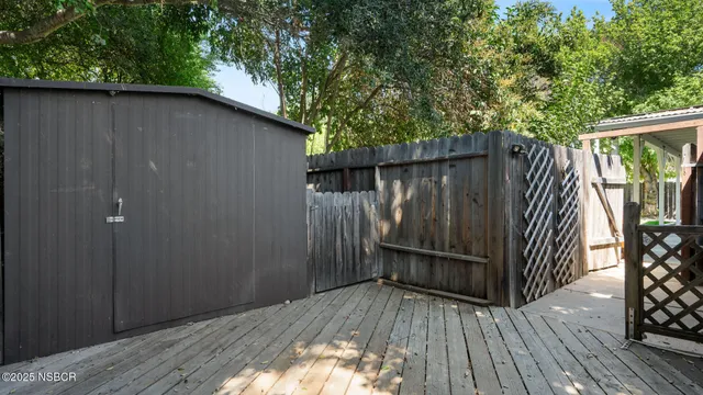 a backyard of a house with wooden floor
