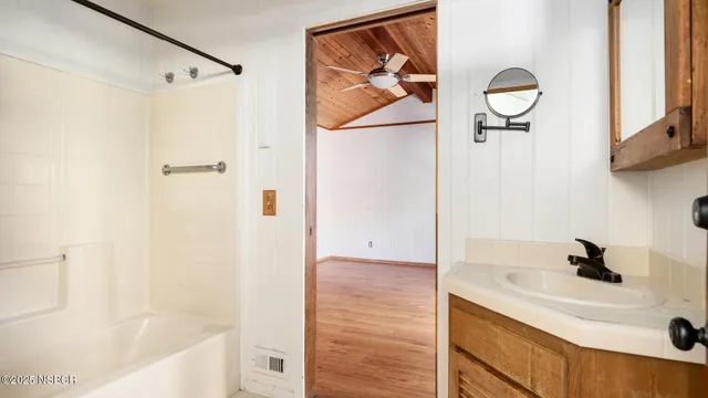 a bathroom with a tub and a shower