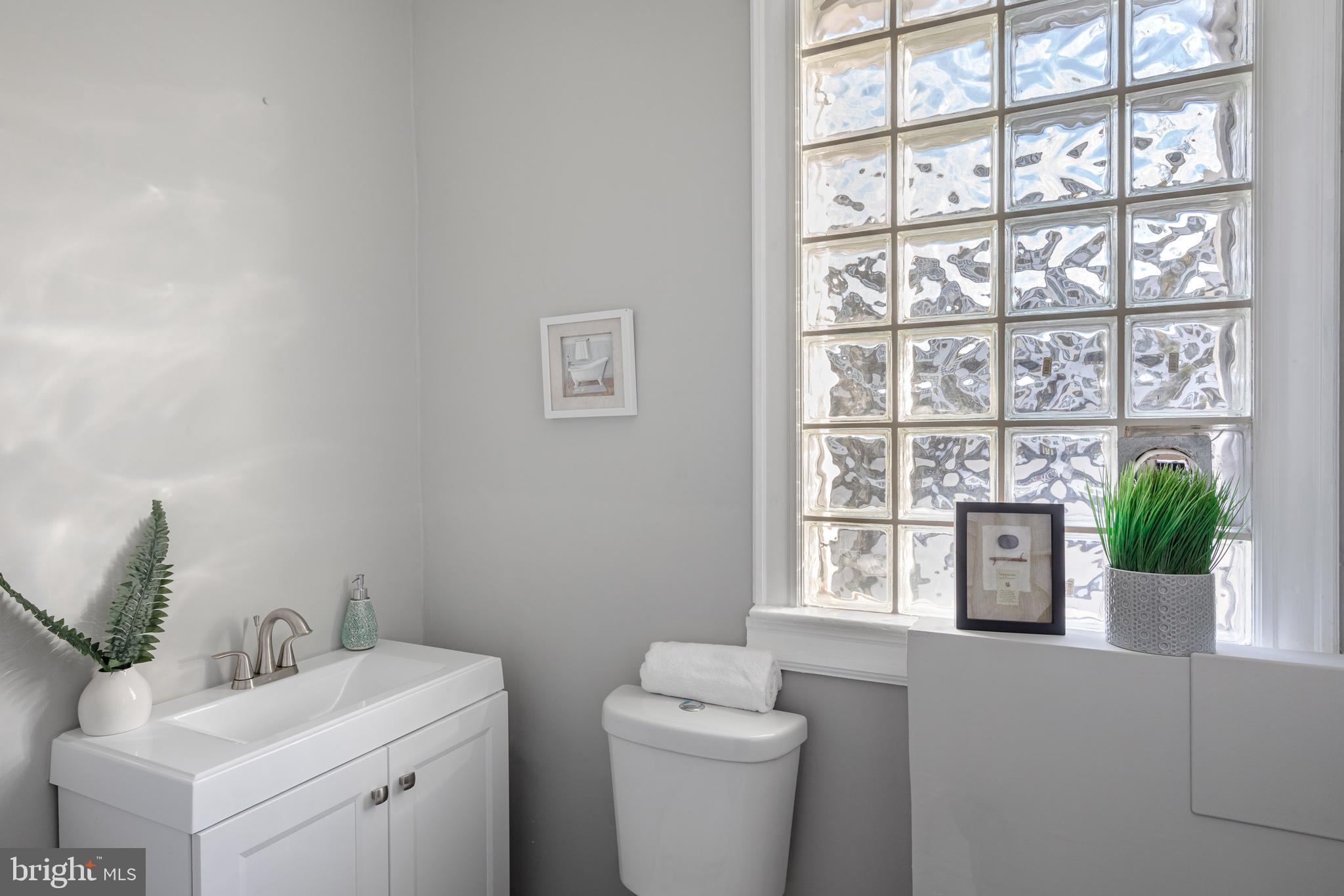 216 Rhode Island Avenue Northwest Washington, DC 20001 - Photo 13 of 28 Powder room includes a laundry hookup.