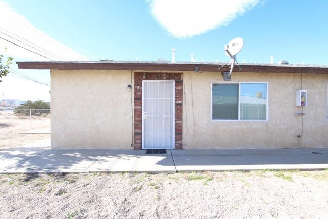 16315 Juniper Street, Unit 4 Hesperia, CA 92345 - Photo 15 of 24 a view of a livingroom with wooden floor and a large window