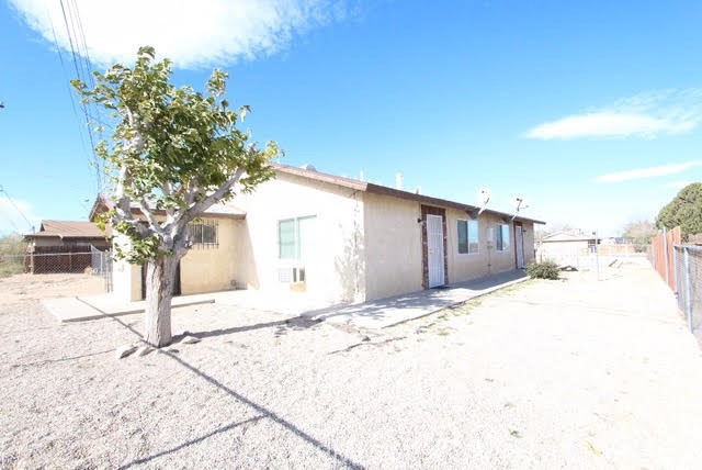 16315 Juniper Street, Unit 4 Hesperia, CA 92345 - Photo 18 of 24 a view of a backyard of the house