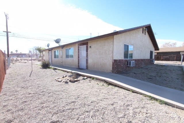 16315 Juniper Street, Unit 4 Hesperia, CA 92345 - Photo 19 of 24 a backyard of a house