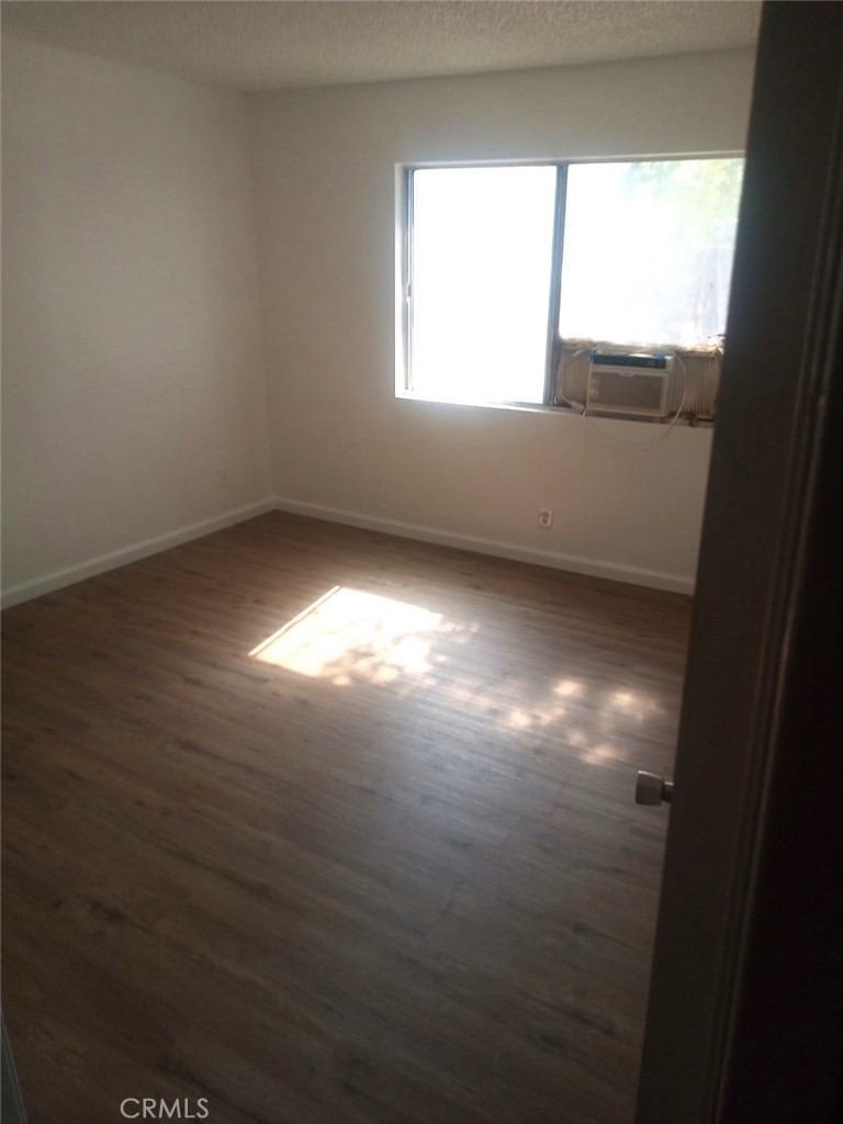 16315 Juniper Street, Unit 4 Hesperia, CA 92345 - Photo 10 of 24 a view of an empty room and window
