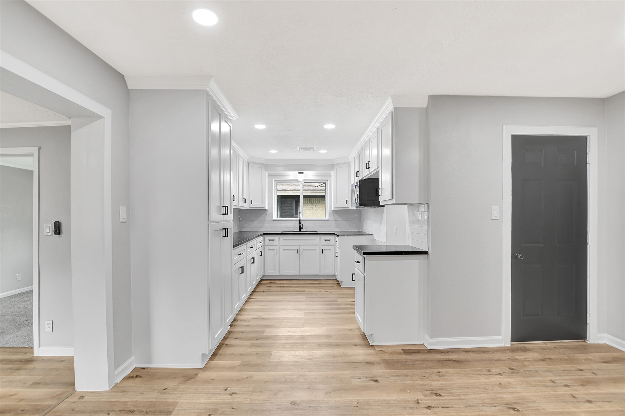 704 Teabury Street Pasadena, TX 77503 - Photo 13 of 43 a large kitchen with stainless steel appliances lots of counter space and a refrigerator