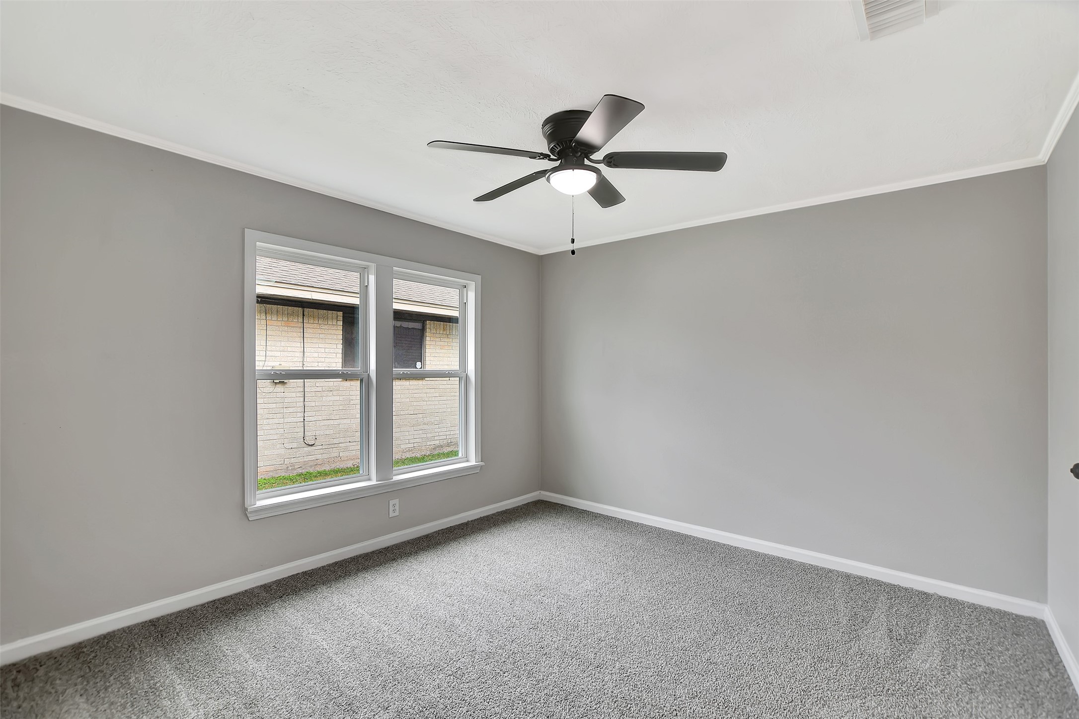 704 Teabury Street Pasadena, TX 77503 - Photo 26 of 43 an empty room with windows and fan