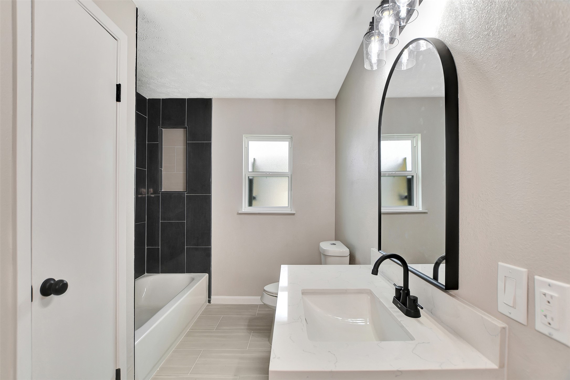 704 Teabury Street Pasadena, TX 77503 - Photo 29 of 43 a bathroom with a sink and mirror