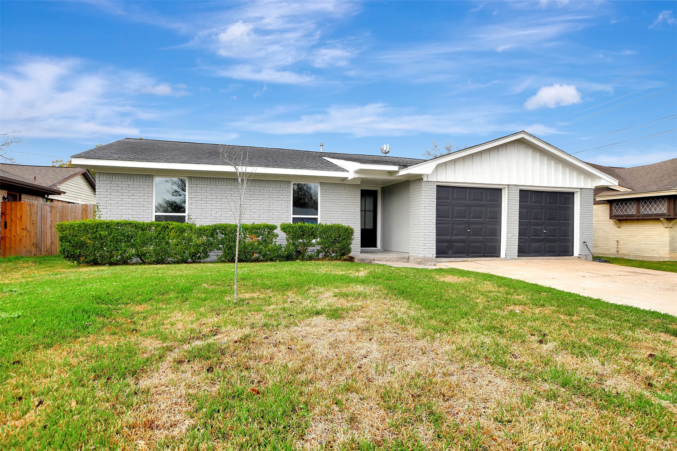 704 Teabury Street Pasadena, TX 77503 - Photo 3 of 43 a view of a yard in front of a house with plants and large tree