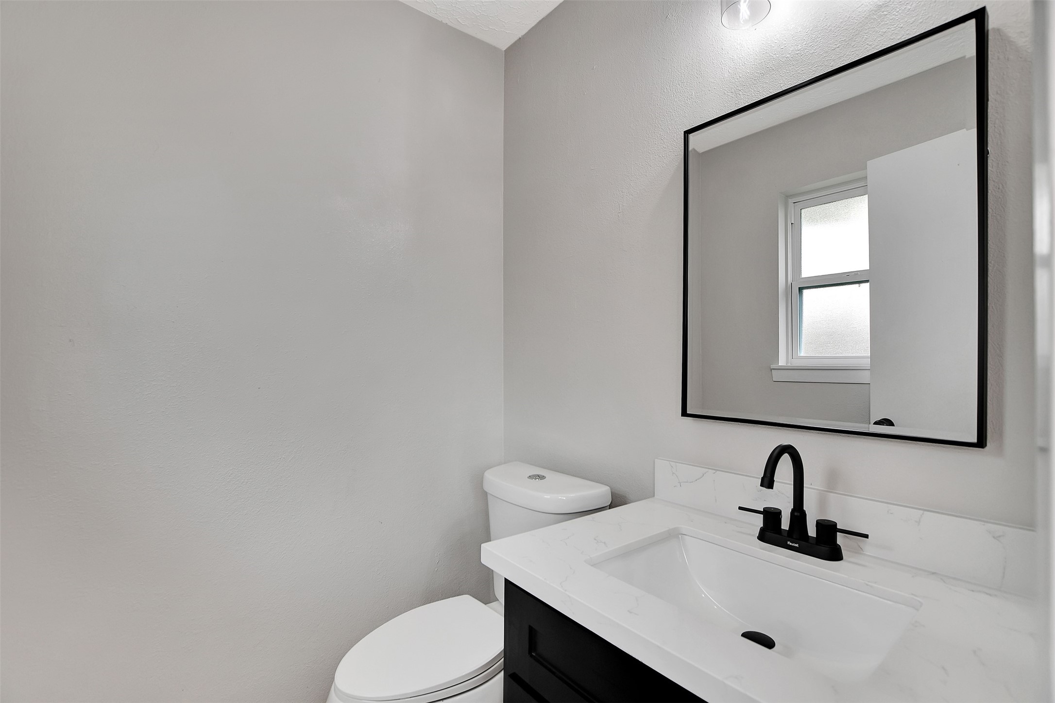 704 Teabury Street Pasadena, TX 77503 - Photo 33 of 43 a bathroom with a sink a toilet and mirror