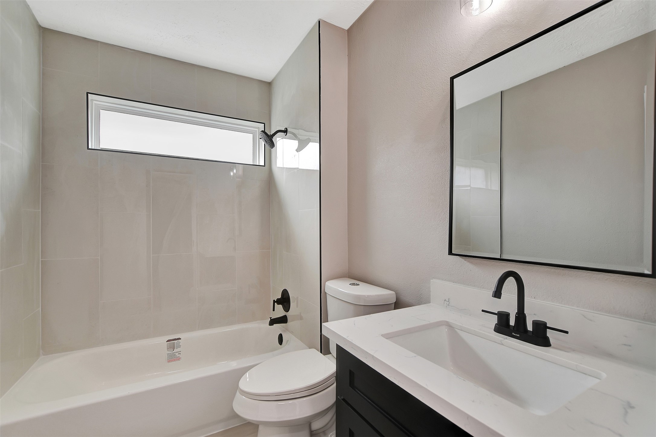 704 Teabury Street Pasadena, TX 77503 - Photo 35 of 43 a bathroom with a granite countertop sink toilet and shower