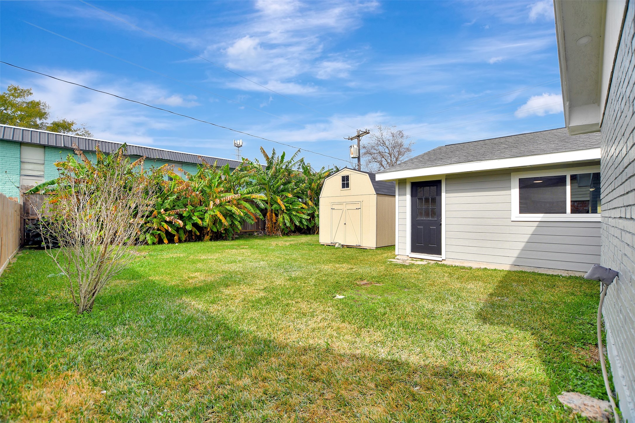 704 Teabury Street Pasadena, TX 77503 - Photo 37 of 43 a view of a backyard with plants and a garden