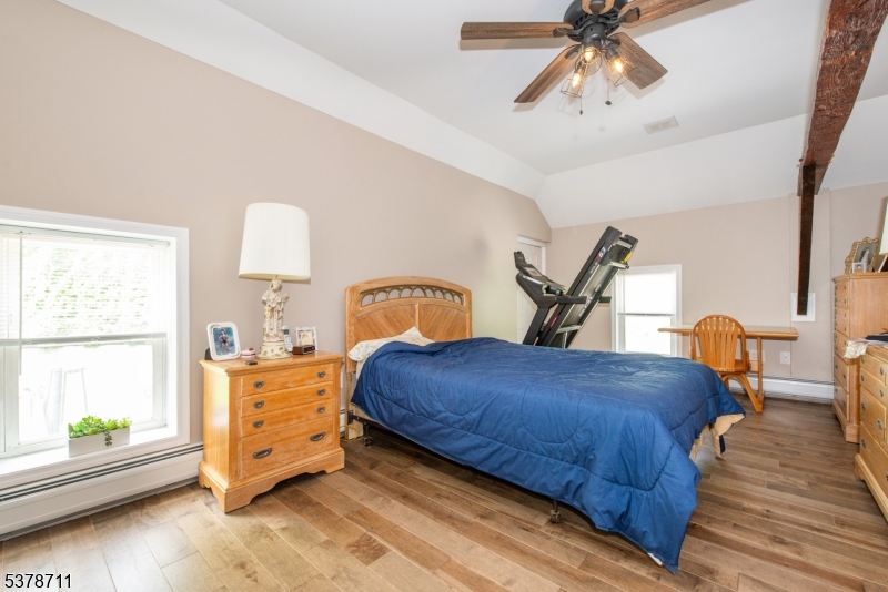 1856 Rt565, Unit 1 Glenwood, NJ 07418 - Photo 12 of 20 a bedroom with a bed and window