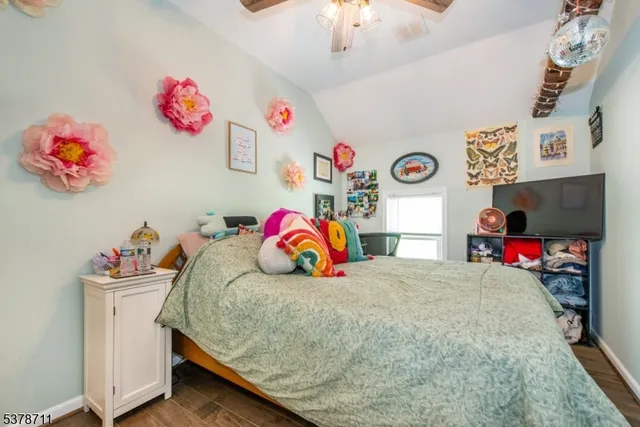 a bedroom with a bed and a baby couch