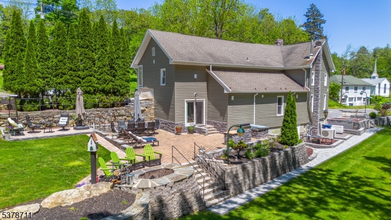 1856 Rt565, Unit 1 Glenwood, NJ 07418 - Photo 2 of 20 a view of house with backyard seating area and green space